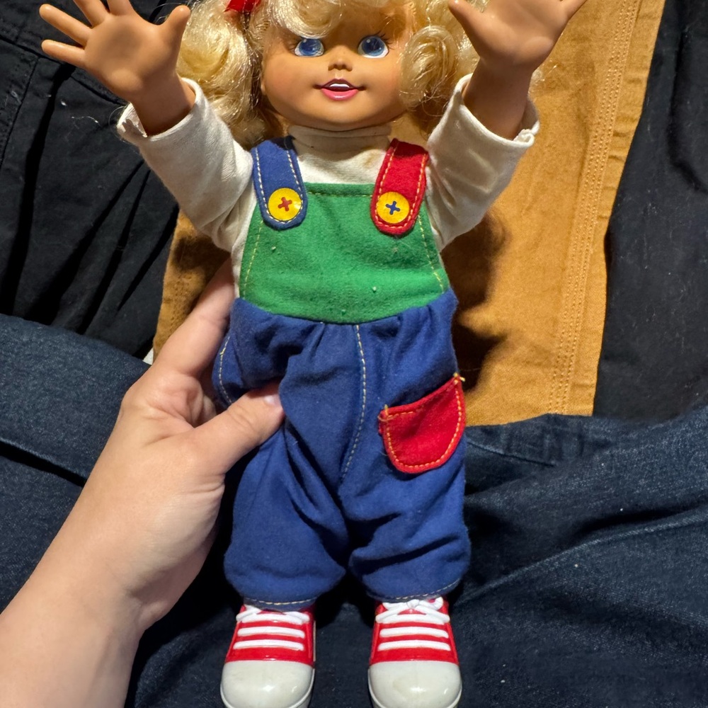 Child Doll with Blue Overalls and Green Bib Accent